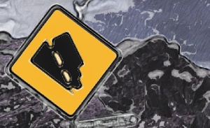 This featured image presents the picture of a mountain highway encountering a road sign indicating steep, steep, steep downgrade ahead, with the title of "U.S. Economy", to communicate the parody of the slowing U.S. economy in light of the current news media reporting the opposite, as claimed by the U.S. federal government.